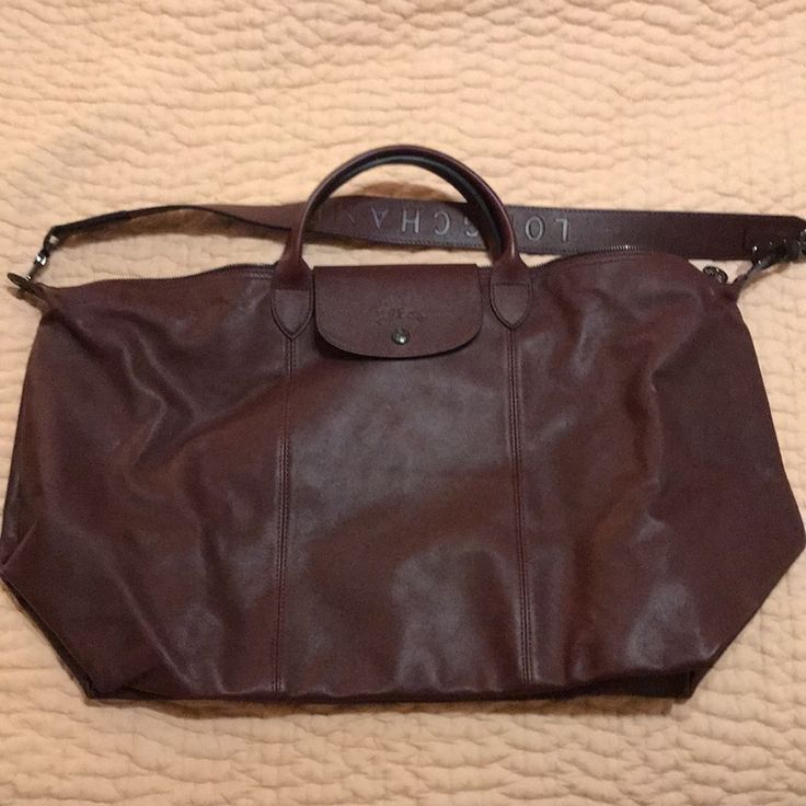 New Never Used! Le Pliage Leather Travel Satchel In Burgundy. Longchamp Luggage, Burgundy Longchamp, Longchamp Travel Bag, Longchamp Le Pliage Large, Longchamp Le Pliage Pouch With Handle, Longchamp Leather, Longchamp Le Pilage Backpack, Longchamp Expandable Travel Bag, Weekend Duffle Bag