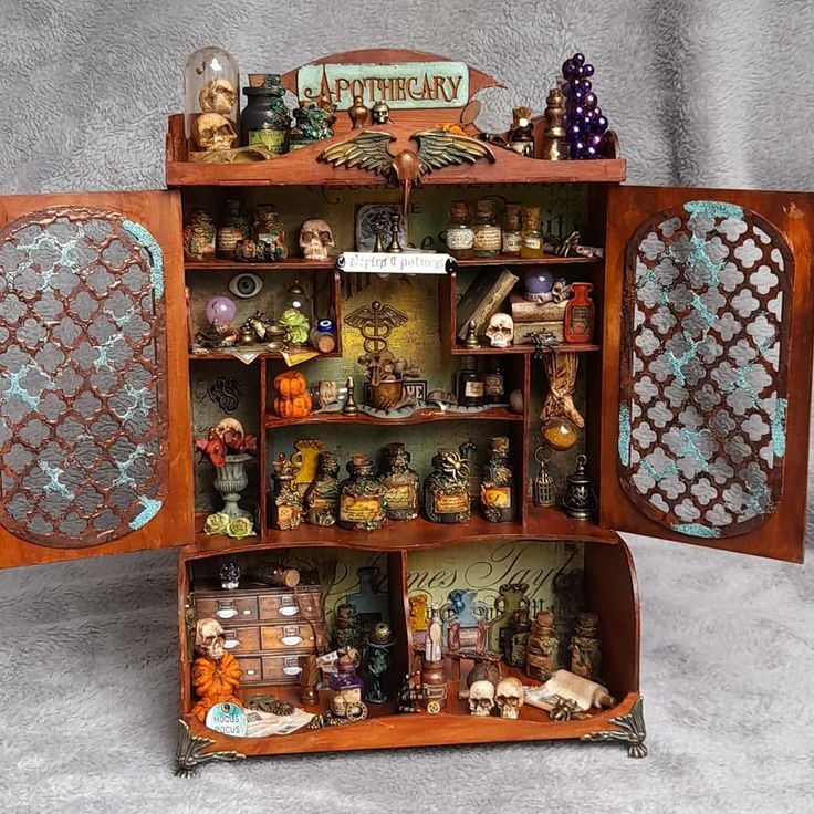 an old fashioned wooden cabinet with many items on it's shelves and doors open