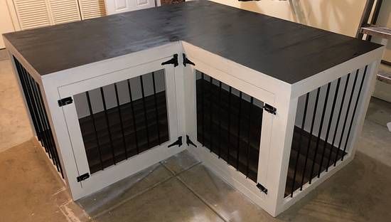 the dog kennel is built into the floor and has two doors on each side