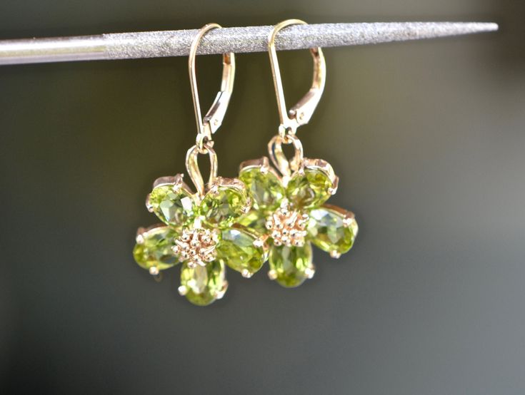 Gold Peridot Earrings Fine Jewelry, Yellow Gold Peridot Earrings For Gift, Fine Jewelry With Peridot And Matching Earrings, Elegant Pierced Peridot Jewelry, Elegant Peridot Earrings With Ear Wire, Elegant Peridot Dangle Earrings, Yellow Gold Peridot Dangle Earrings, Elegant Peridot Earrings For Anniversary, Elegant Peridot Earrings