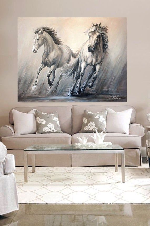 two horses running in the wind on a canvas