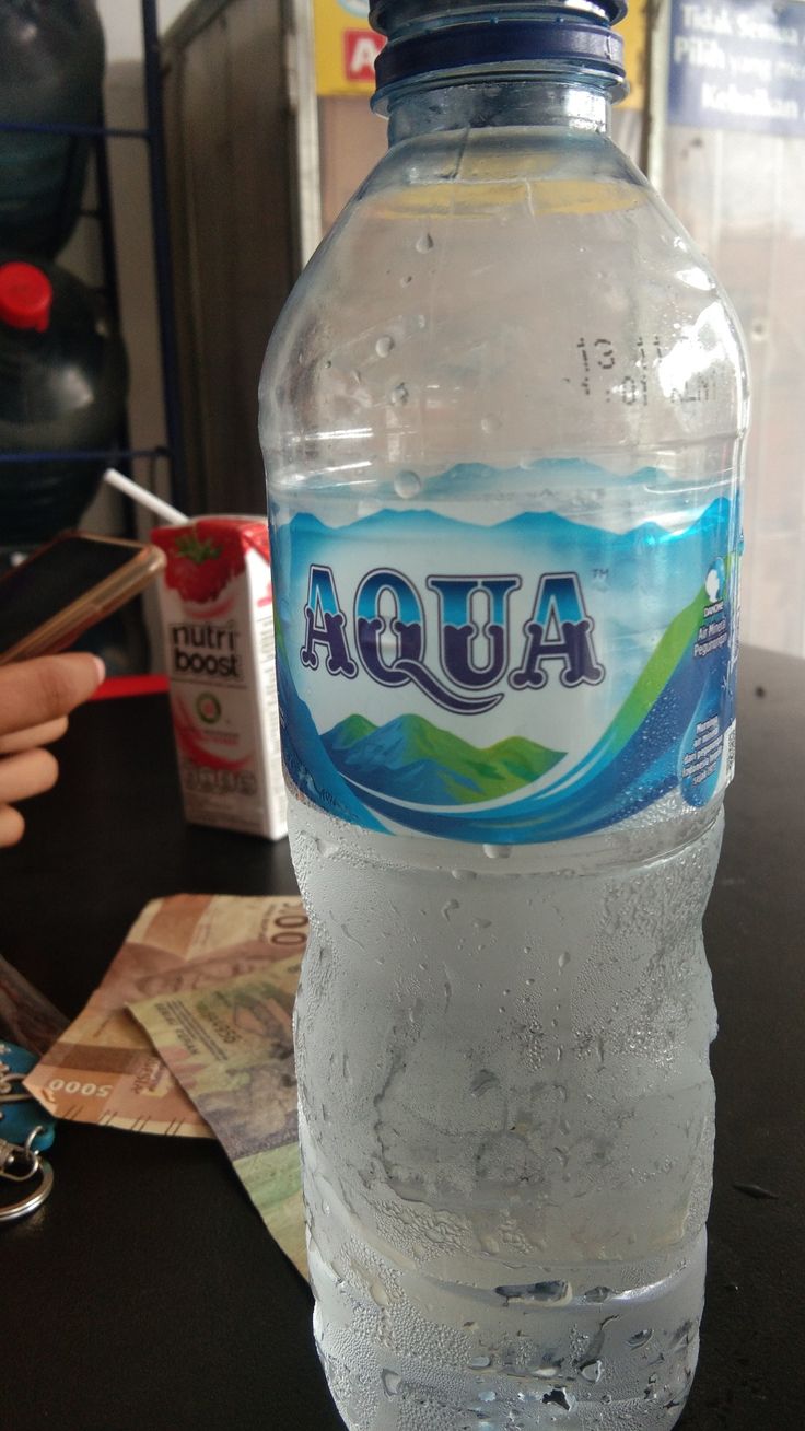 a bottle of water sitting on top of a table