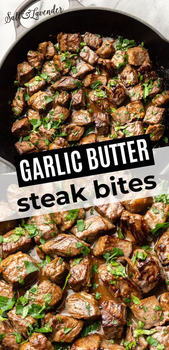 garlic butter steak bites in a cast iron skillet with green garnish on top