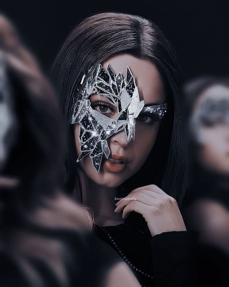 a woman with a mask on her face and some other women behind her looking in the same direction