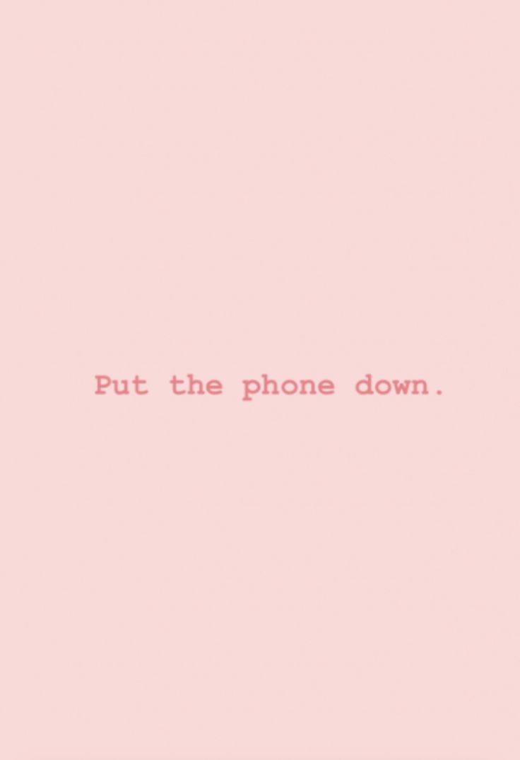 a pink background with the words put the phone down