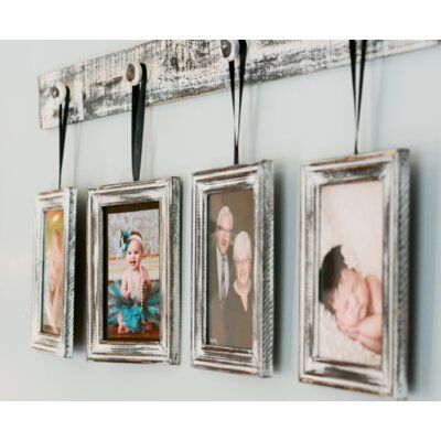 four framed photos hang on a wall