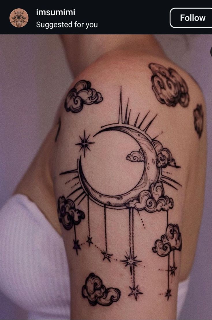 a woman's arm with an image of the moon and stars on it