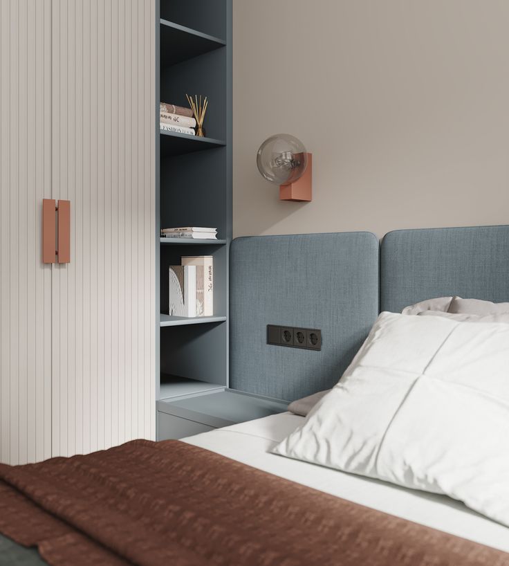 a bedroom with a bed, bookshelf and nightstand