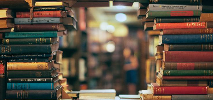 there are many books on the shelves in this room and one is full of them