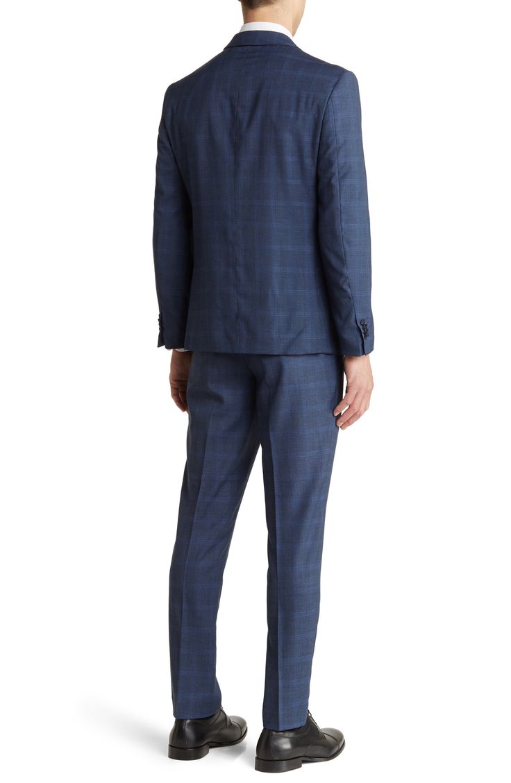 Classic and versatile, this well-dressed plaid suit crafted from supersoft and stretchy fabric features a peaked lapel jacket and flat-front trousers. 28" length, bottoms: 32" inseam; 10" rise (size 40R)
 Jacket has peak lapels; four-button cuffs; chest pocket; flap pockets
 Trousers have zip fly with hook-and-bar closure; slant pockets; back button-welt pockets 84% polyester, 15% rayon, 1% spandex Dry clean Imported Fitted Sets With Welt Pockets For Business Casual, Fitted Business Casual Sets With Lapel Collar, Tailored Notch Lapel Blazer In Elastane, Tailored Notch Lapel Elastane Blazer, Tailored Elastane Blazer With Notch Lapel, Fitted Plaid Blazer With Welt Pockets, Tailored Suiting Fabric Sets For Business Casual, Tailored Plaid Suit With Notch Lapel, Plaid Suits With Welt Pockets And Suit Collar