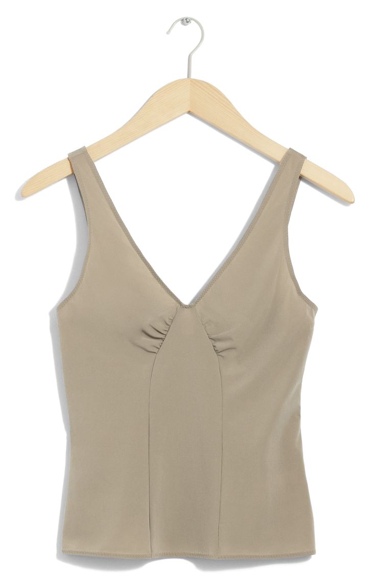 A structured silhouette amplifies the everyday sophistication of this stretchy V-neck tank top. V-neck 76% polyamide, 24% elastane Dry clean Imported Seamless V-neck Top For Summer, Fitted V-neck Top With Medium Bust Support, Bra-friendly Fitted V-neck Tank Top, Bra Friendly Sleeveless Elastane Tank Top, Fitted V-neck Bra Friendly Tank Top, Bra Friendly Fitted V-neck Tank Top, Spring V-neck Elastane Tank Top, Elastane V-neck Top With Built-in Bra, Fitted V-neck Seamless Camisole