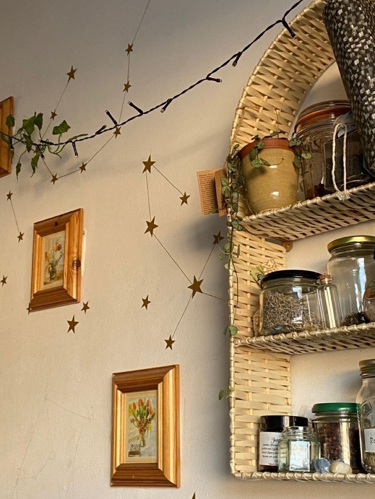 the wall is decorated with gold stars and jars