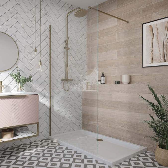 the bathroom is decorated in white and beige tones, with geometric tiles on the floor