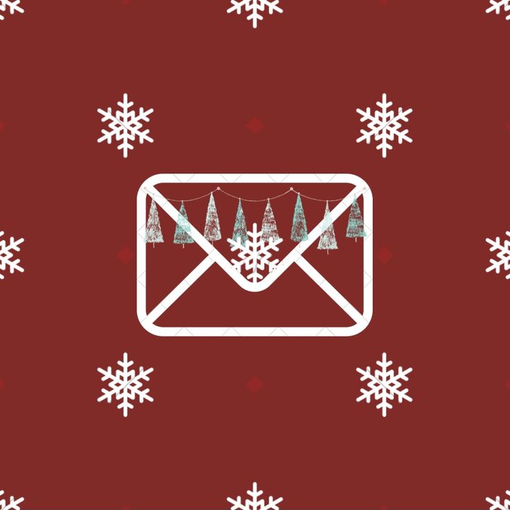 an envelope with christmas trees on it and snowflakes all over the wall behind it