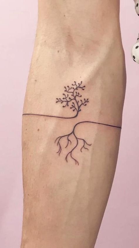 a small tree with roots on the side of its leg is shown in black ink