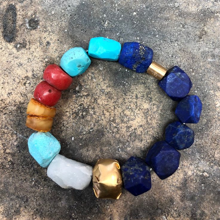 ANCIENT STONE BRACELET WITH 22K GOLD CLOSURE • DESIGNED AND HAND FORGED IN NEW YORK • STONES: LAPIS, TURQUOISE, CORAL, AND AMBER BEADS • LENGTH: 6.5 INCHES Please email info@elihalili.com or call the studio at 212-941-7979 for any inquiries. Rectangular Gemstone Bracelet In Yellow Gold, Gold Fusion Bracelets With Round Beads, Rectangular Yellow Gold Bracelet With Gemstone, Bohemian Gold Rondelle Bracelets, Gold Bohemian Rondelle Bracelets, Adjustable Gold Beaded Bracelets With Stones, Luxury Multicolor Gold Bracelet As A Gift, Luxury Multicolor Gold Bracelet As Gift, Luxury Multicolor Gold Bracelet For Gift