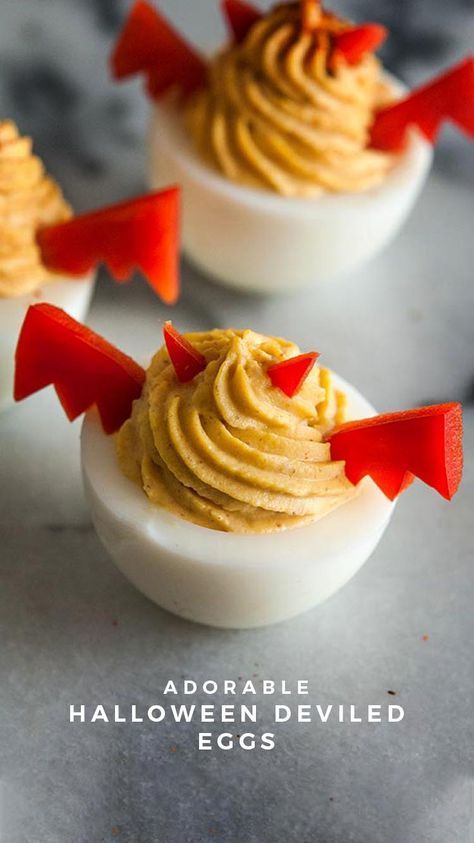 deviled eggs with red arrows sticking out of them