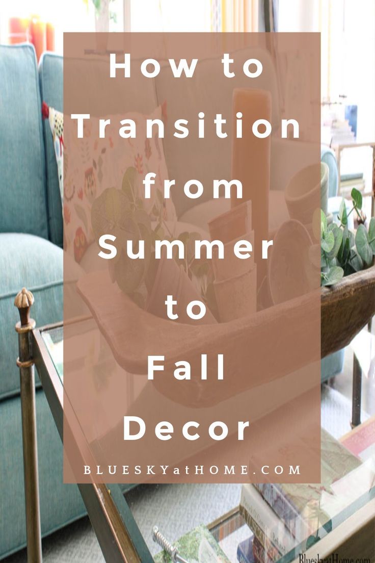 a living room with blue couches and a coffee table in the foreground text reads how to transition from summer to fall decor