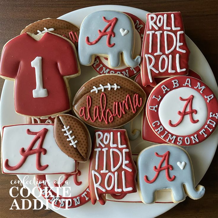 decorated cookies on a plate with letters and numbers