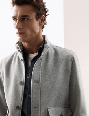 Immaculately tailored and extremely elegant, this cosy and hardwearing wool-blend utility jacket from our Autograph collection is a chilly weather essential. It's made in an easy regular fit and lined for extra comfort. The funnel neck offers two-way styling and additional warmth, while the front and cuffs buttons keep out the damp and cold. Two flap pockets are perfect for storing your essentials safely.\n \nAutograph: premium investment pieces featuring contemporary cuts and refined finishing Winter Merino Wool Outerwear With Funnel Neck, Casual Wool Outerwear With Funnel Neck, Luxury Merino Wool Outerwear With Funnel Neck, Gray Wool Outerwear With Concealed Placket, Luxury Merino Wool Funnel Neck Outerwear, Wool Blend Jacket, Chilly Weather, Funnel Neck, Utility Jacket