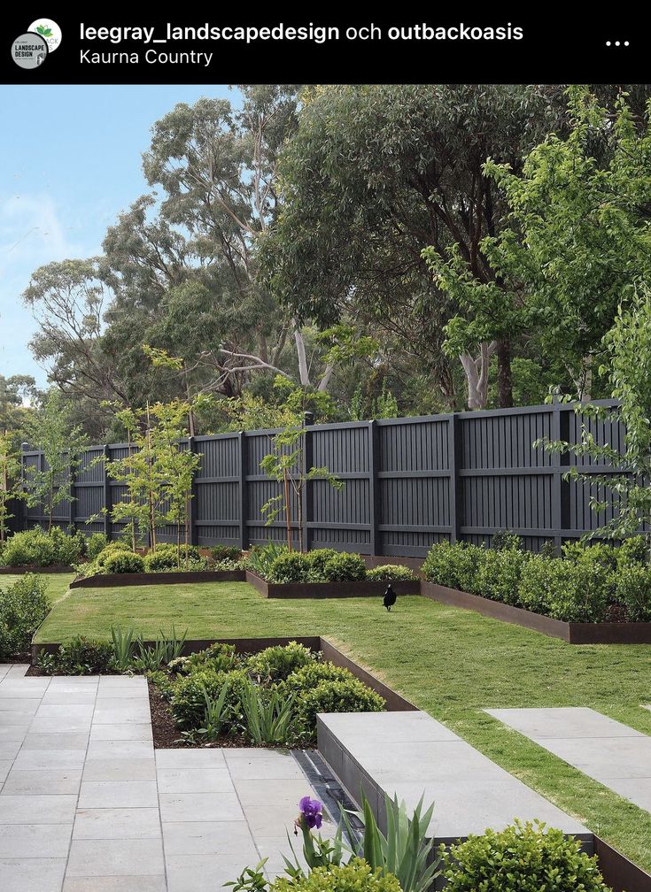 an image of a garden with trees and grass