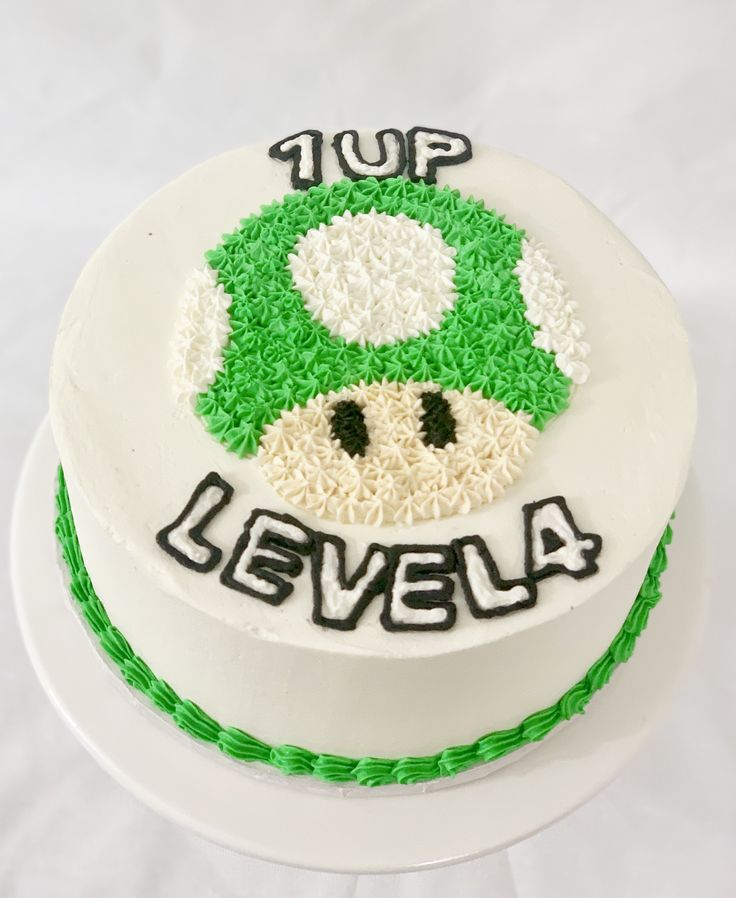 a white cake with green and white frosting