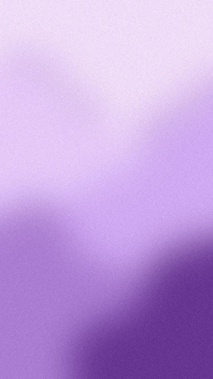 a blurry image of an airplane flying in the sky with purple and white colors