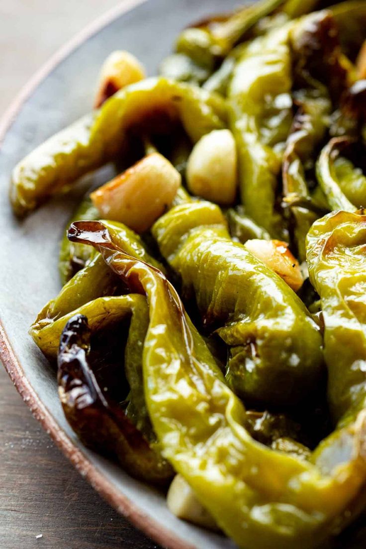 some green peppers are on a plate and ready to be eaten