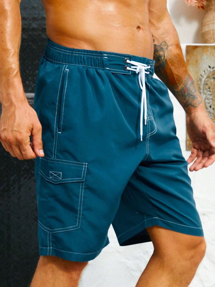 Stay organized and stylish with our Flap Pocket Swim Trunks. These swim trunks feature convenient flap pockets, providing storage for your essentials while on the beach or at the pool. The waistband offers a comfortable fit, and the quick-drying fabric ensures optimal comfort in and out of the water. Features: Color: Blue Pattern Type: Plain Details: Drawstring, Pocket Type: Bottoms Bottom Type: Shorts Fabric: Non-Stretch Care Instructions: Machine wash, do not dry clean Body: Lined Sheer: No Si Outdoor Bottoms With Pockets For Beach Season, Nylon Swim Trunks With Side Pockets, Summer Nylon Swim Trunks With Side Pockets, Summer Beach Bottoms With Cargo Pockets, Nylon Swimwear With Pockets For Summer, Beach Cargo Shorts For Summer, Nylon Beachwear Swimwear With Pockets, Functional Swimwear With Side Pockets For Summer, Sporty Swimwear With Pockets For Beach Season