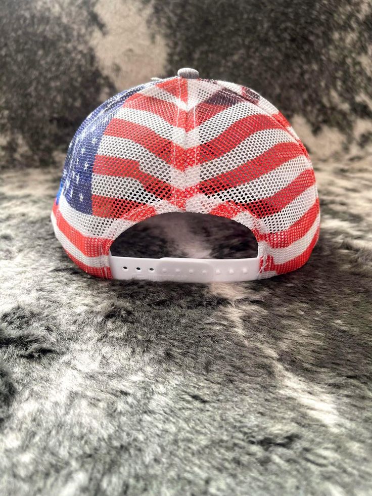 Spur Up Hat - Patriot is a snapback hat with grey chino twill front panels and an American flag sublimated on it's back mesh panels. Featuring a 3D embroidered spur in blue, and "Bronco" on the side in the same color. SPUR UP - incite to action, accelerated growth or development. We hope by wearing this hat you have the drive and fire within to achieve your dreams. * OSFA * Structured Crown * Slight Pre-curved Visor #ridethebronco Patriotic Trucker Hat With Curved Brim For Baseball Season, Patriotic Memorial Day Snapback Trucker Hat, Patriotic White Snapback Trucker Hat, Grey Chino, Patriotic Hats For Outdoor, One Size Fits Most, Adjustable Western 5-panel Trucker Hat, Grey Chinos, Achieve Your Dreams, Denim Boots