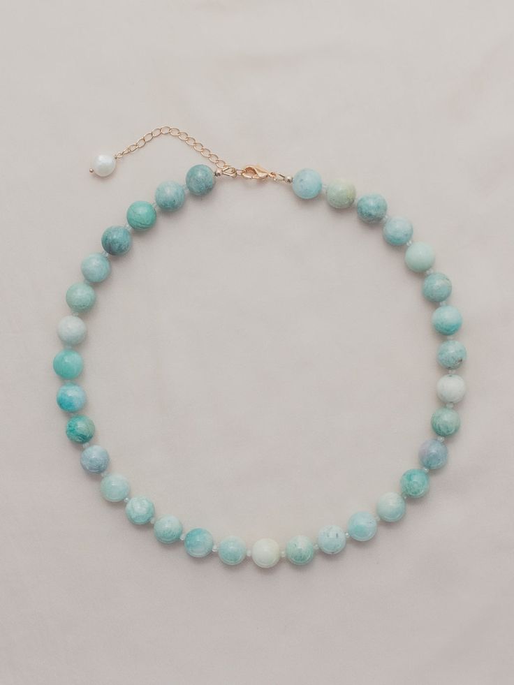 Amazonite and faceted aquamarine, freshwater pearl charm Gold-filled lobster clasp closure Length - 16.5" + 2" extender Handmade in Newport, RI *Due to the unique nature of freshwater pearls and genuine stones there will be slight variations from images on site Faceted Turquoise Amazonite Jewelry, Turquoise Faceted Amazonite Jewelry, Aquamarine Necklaces With Round Beads Of Natural Stones, Aquamarine Necklace With Round Natural Stones, Aquamarine Necklace With Natural Round Beads, Aquamarine Necklace With Round Natural Stone Beads, Blue Amazonite Jewelry With Single Strand, Blue Amazonite Single Strand Jewelry, Blue Single Strand Amazonite Jewelry