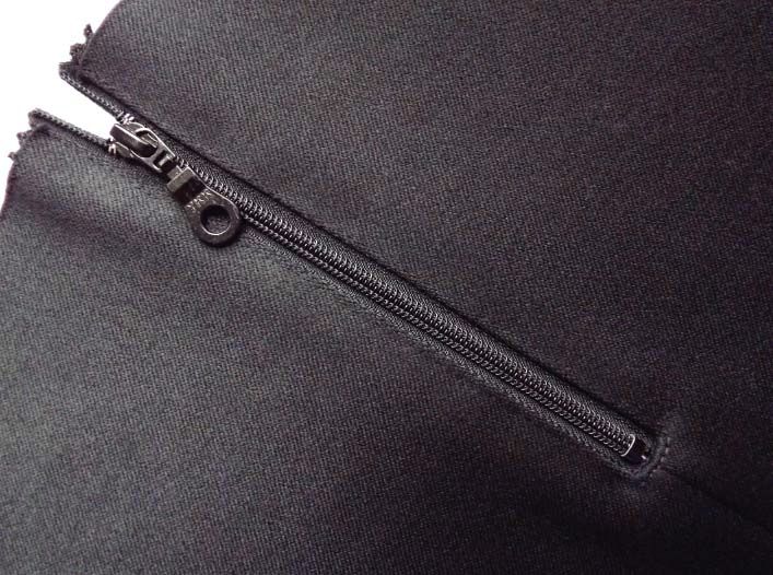 the zippers are visible on this black piece of clothing