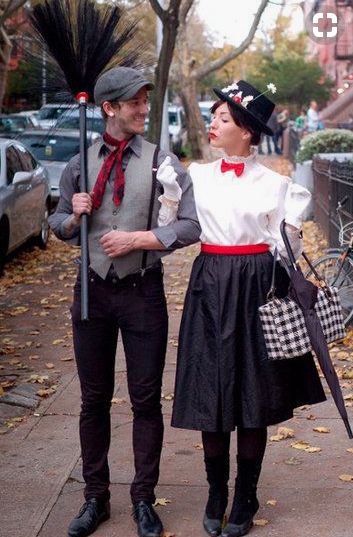 a man and woman dressed in costumes standing next to each other