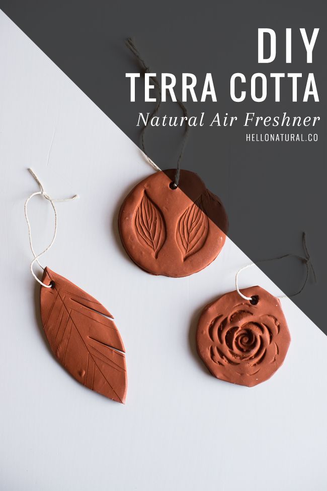 three clay earrings with leaves on them and the words terra cota natural air fresheners