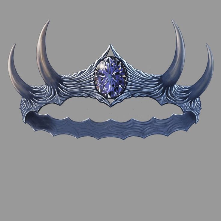 an artisticly designed head piece with two horns and a purple stone in the center