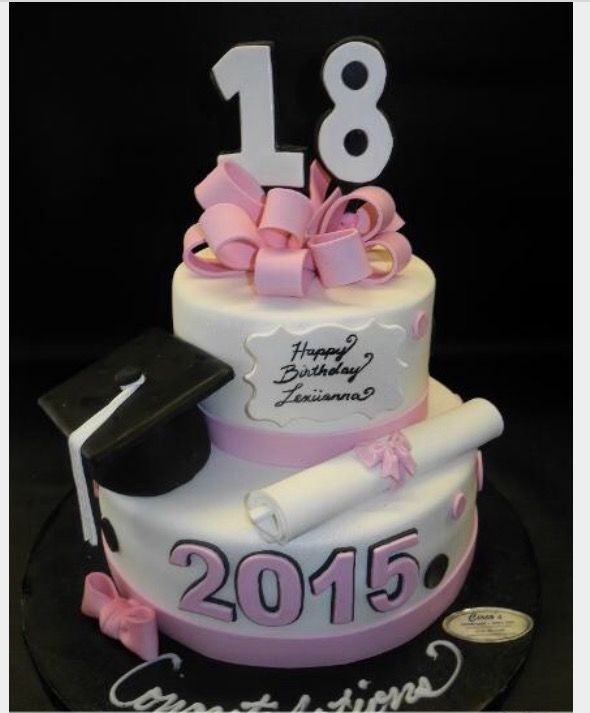 a three tiered cake decorated with pink and white ribbon, graduation cap and diploma