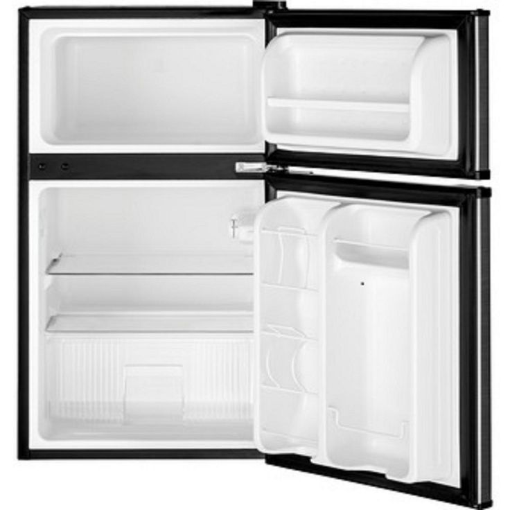 an open refrigerator freezer with the door ajar and no ice maker on it