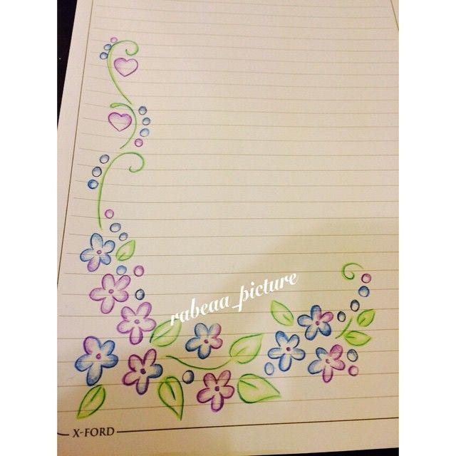 a notepad with flowers and hearts drawn on it