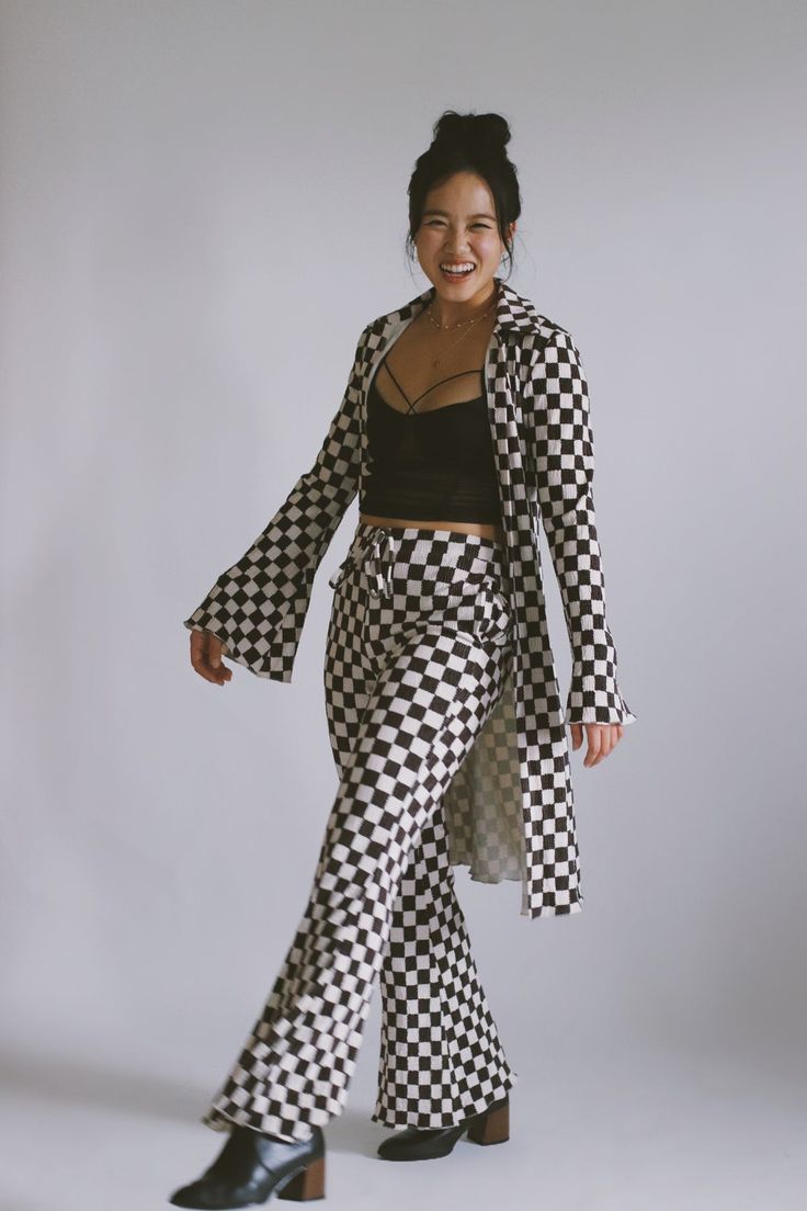 100% Polyester  Models wearing size small and large Luxury Casual Plaid Pants, Luxury Houndstooth Formal Bottoms, Luxury Formal Houndstooth Bottoms, Checkered Bell Bottom Pants, Luxury Plaid Bottoms For Women, Luxury Formal Bottoms With Houndstooth Pattern, Chess Outfit, Checkered Dress Outfit, Checkered Pants Outfit