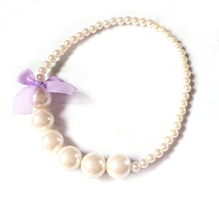 Elegant and pretty pearl necklace! Makes a lovely accessory to any outfit. Choose from a purple or pink ribbon. Beads are placed though an elastic string. Style it with any of our designs to complete your look. Makes a great gift! Shipping: This item is in stock and ready to ship out next business day. Please allow 3-5 business days for delivery within the U.S. Purple Ribbon, Girls Necklaces, Summer 2019, Pink Ribbon, Pearl Necklace, Great Gifts, Spring Summer, Ribbon, Elastic