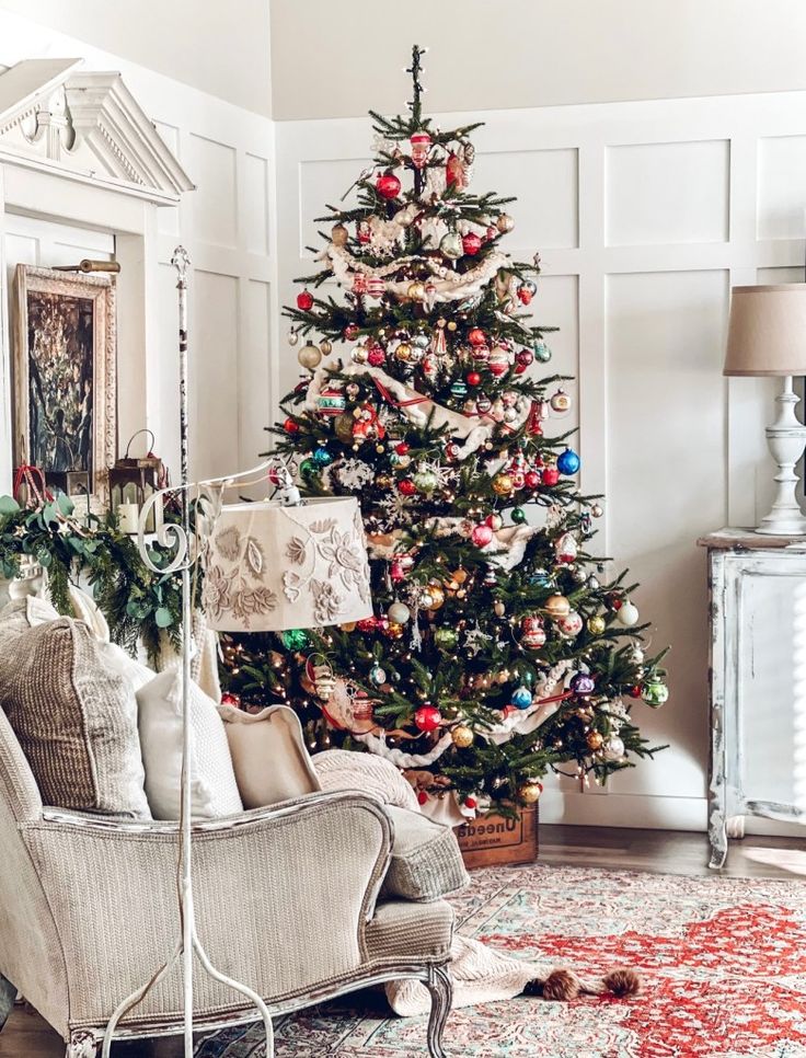 a living room with a christmas tree in the corner