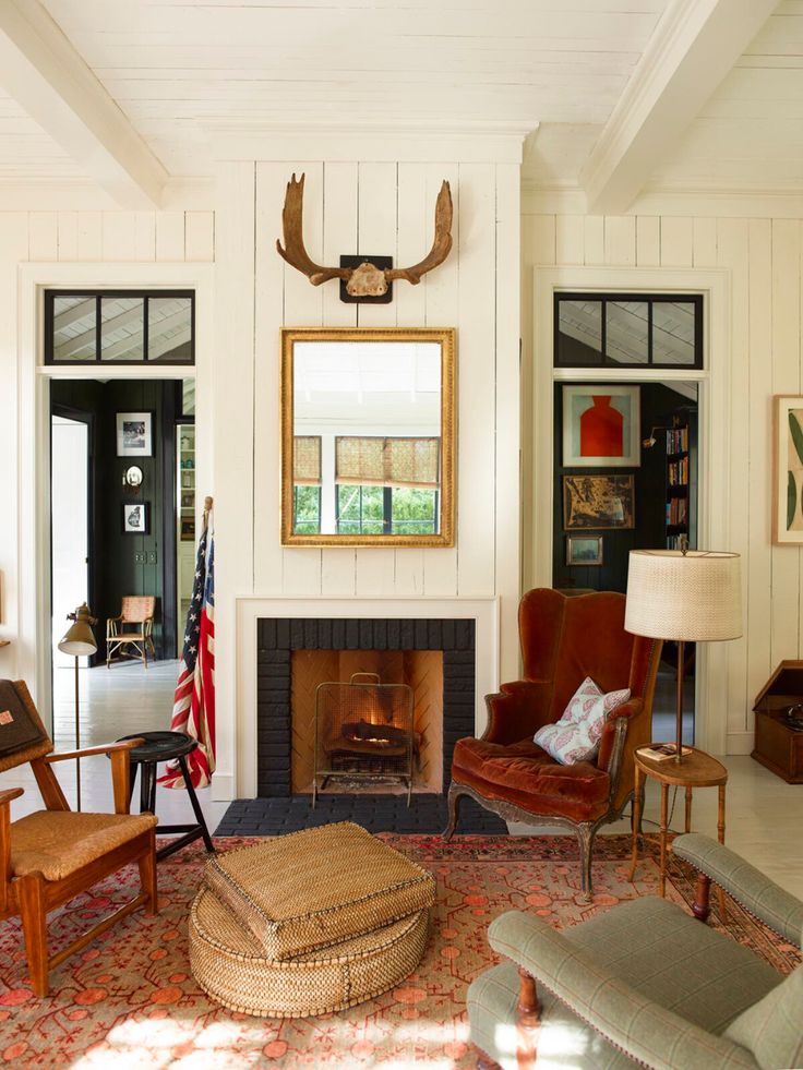 a living room filled with furniture and a fire place