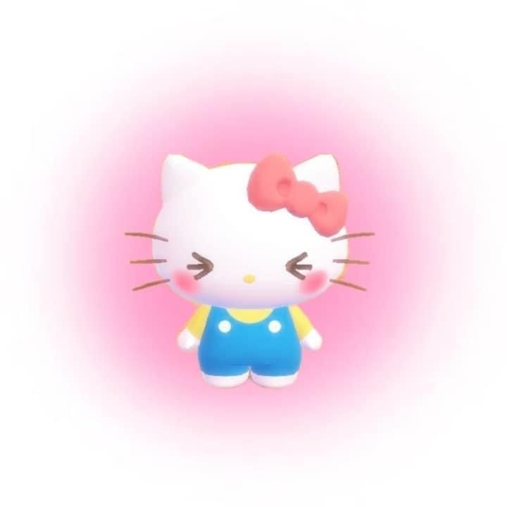 a hello kitty doll with a pink bow on her head and blue shorts, standing in front of a pink background