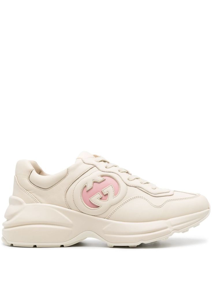 light beige/rose pink calf leather panelled design signature Interlocking G logo debossed logo to the side logo patch at the tongue round toe front lace-up fastening padded ankle leather lining branded leather insole chunky rubber sole Women's Gucci sneakers fit large. For the most comfortable fit please select half a size down. We've partnered with Good On You — an independent agency that rates how brands perform in relation to their impact on the planet, people and animals, with a multi-criter Gucci Rhyton, Gucci Sneakers, Debossed Logo, Chain Strap Bag, Oversized Tote Bag, G Logo, Planet People, Low Top Sneakers, Gucci Shoes