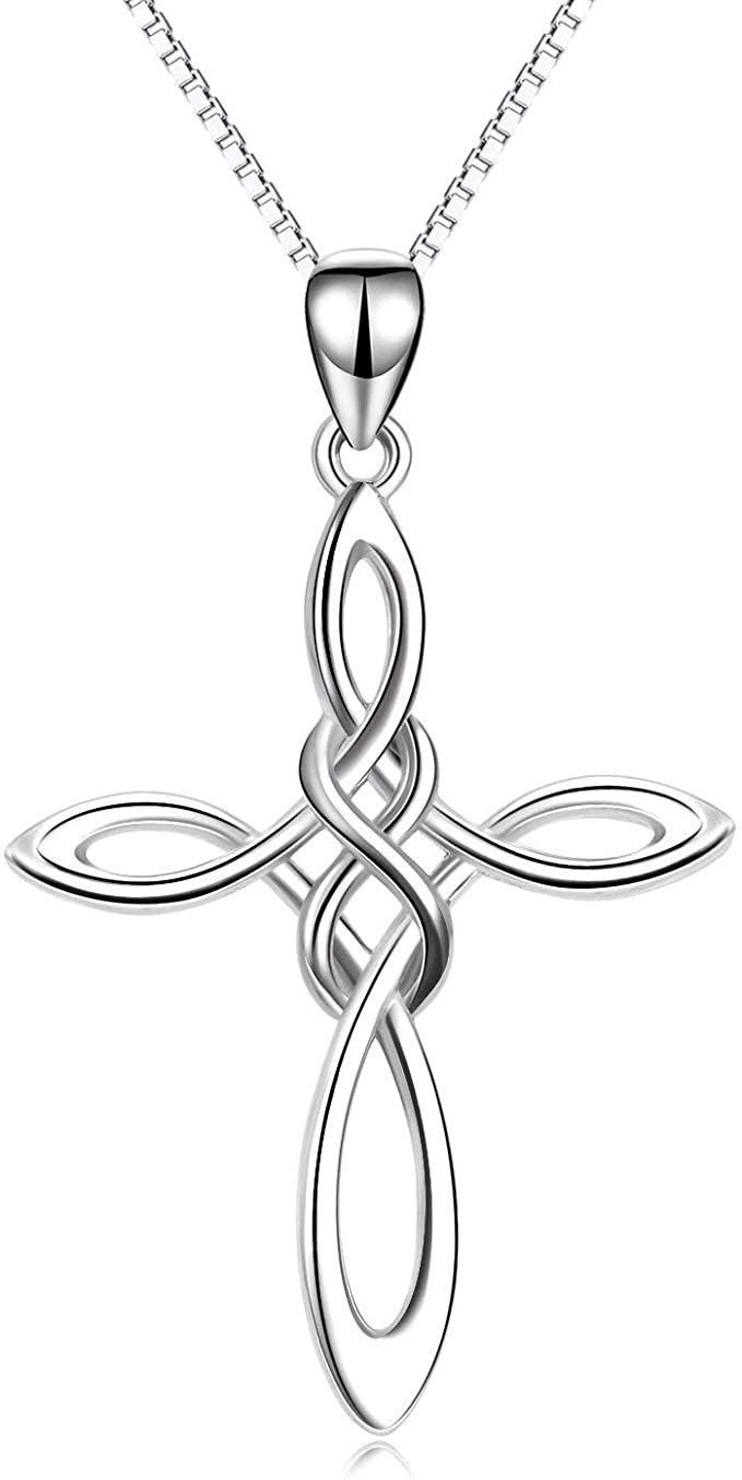 a silver cross necklace with an intricate design on the front and back side, hanging from a