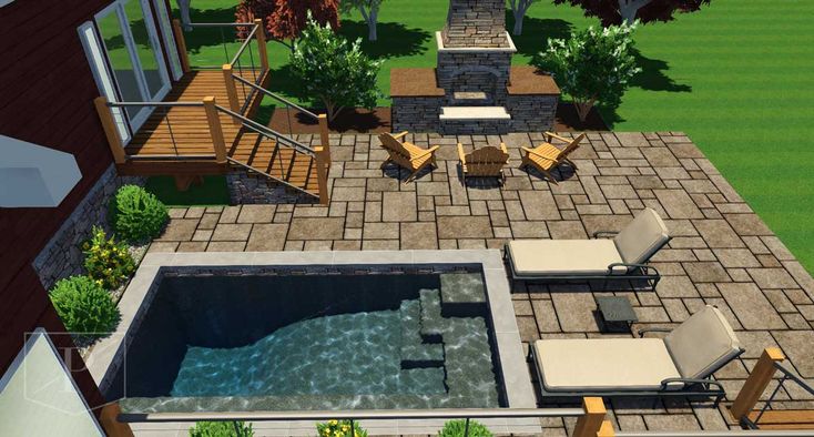 an aerial view of a backyard with a pool and patio furniture in the foreground