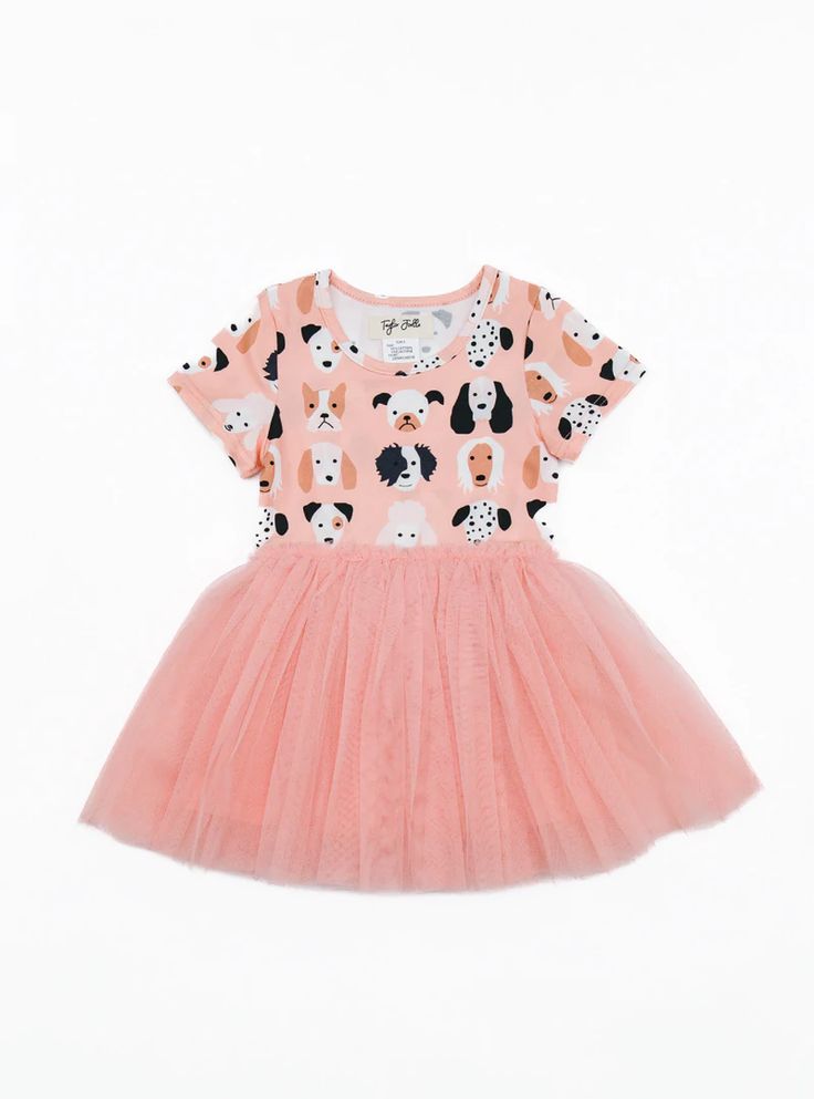 a pink dress with black and white dogs on it