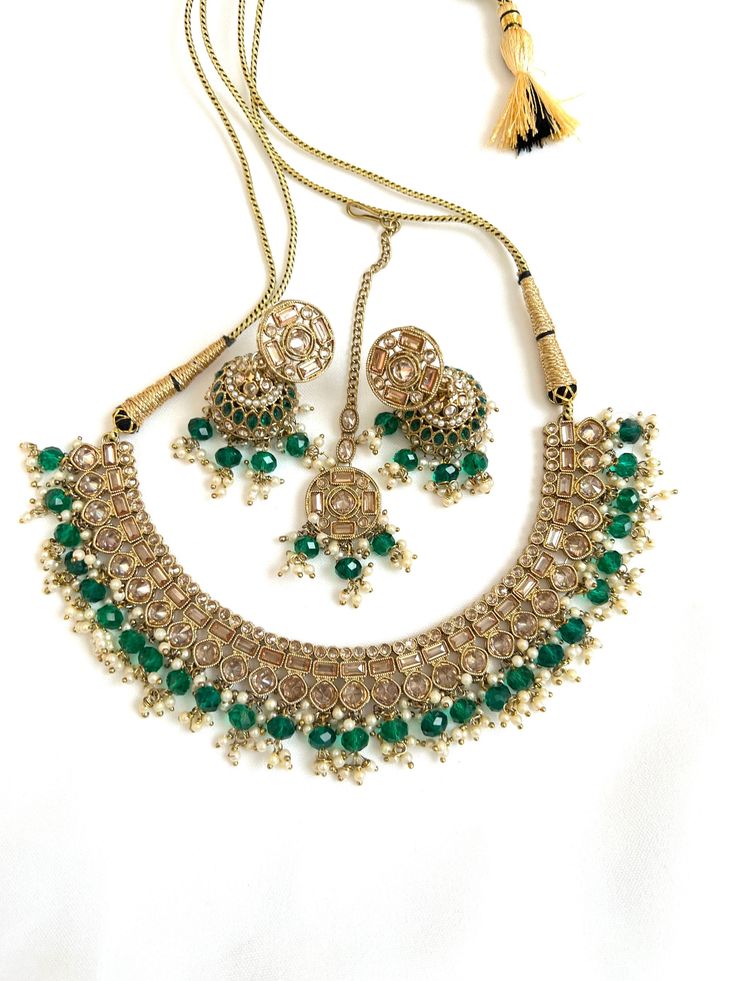 Handcrafted with love to give a real traditional look for this set beautifully studded with polki stones and pearls give a royal look. Includes: Necklace, Earrings, and Tikka Festive Jeweled Jewelry Sets, Festive Gold Beaded Sets, Polki Necklace Set, Necklace Set With Earrings, Ear Chain, Polki Necklace, Royal Look, Indian Earrings, Necklace Earrings