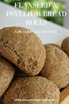 a close up of some bread rolls on a wooden board with text overlay that reads, flaxseed and psylium bread rolls low carb glutter free