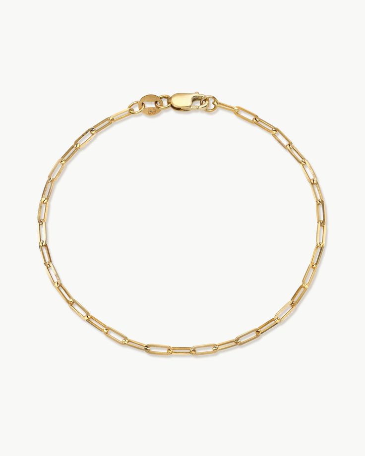 Introducing our solid 14k gold Paperclip Chain Bracelet, the ultimate modern classic. With defined edges and flat surfaces, our Paperclip chain shines from all angles when it hits the light and adds a touch of understated edge to any ensemble. Modern Gold Bracelet With Box Chain, Classic White Gold Paperclip Bracelet For Everyday, Everyday Minimalist Polished Chain Bracelet, Minimalist Polished Chain Link Bracelet, Classic Yellow Gold Paperclip Bracelet With Cable Chain, Modern Box Chain Bracelet With Oval Links, Minimalist Link Bracelet With Polished Finish, Modern White Gold Bracelet For Everyday Wear, Classic Everyday White Gold Chain Bracelet